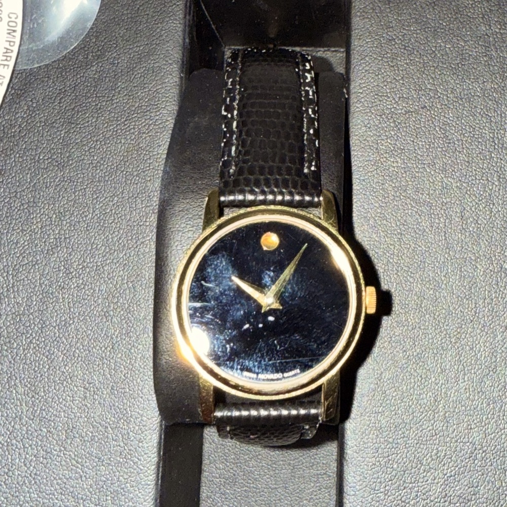 Movado Gold and Black Timepiece